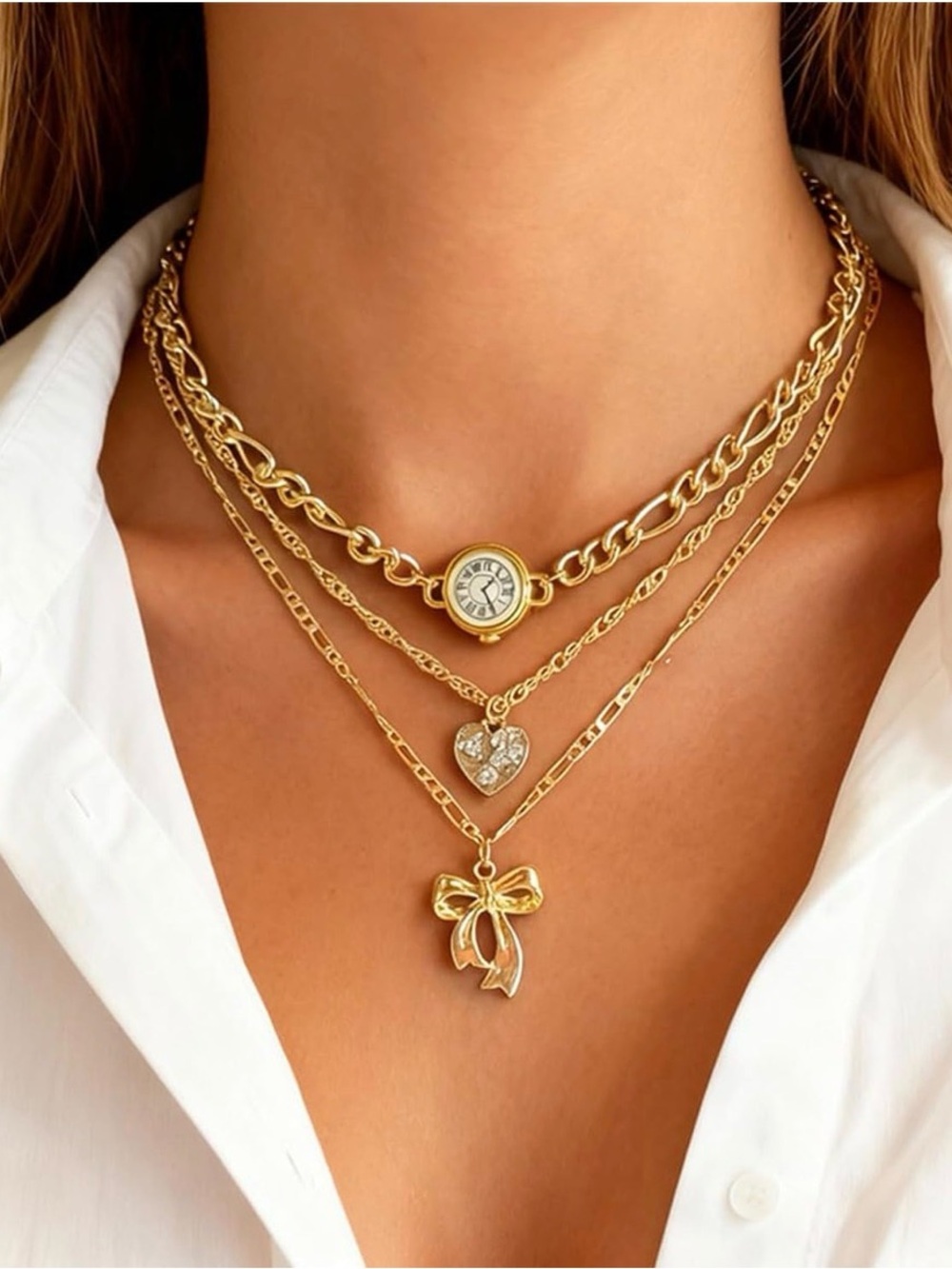 Gold layered necklace with heart and bow charms